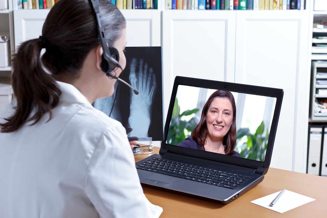 doctor headset xray laptop patient