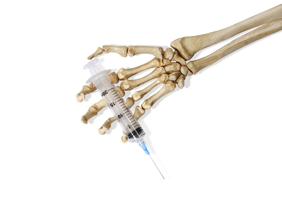 Skeleton Hand With a Hypodermic Needle